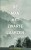 Afbeelding van De man met zwarte laarzen